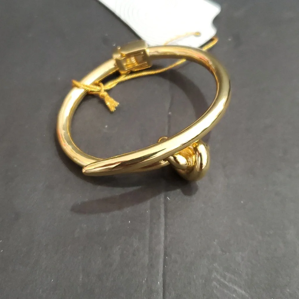 Eye Candy gold tone knot and point open‎ cuff hinged bracelet bangle brand new
